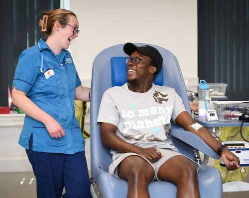 A healthcare assistant with a donor